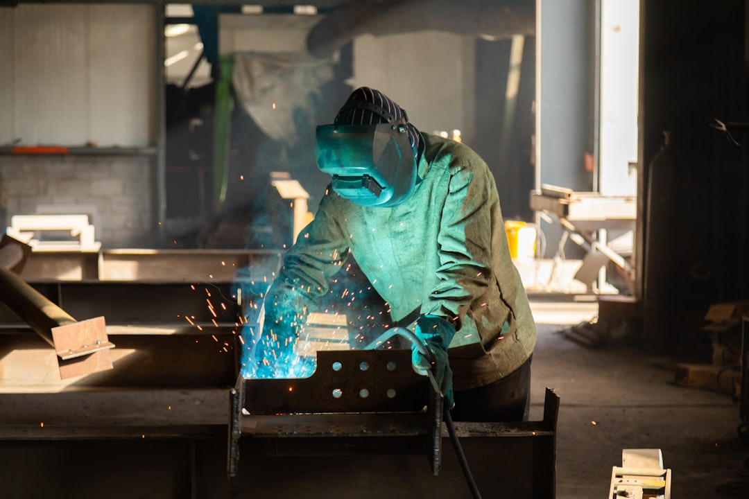 Metal fabrication welding work in a workshop for vehicle parts